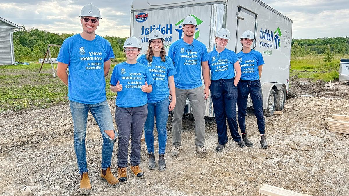 Bruce Power Habitat for Humanity volunteers in hardhats. 